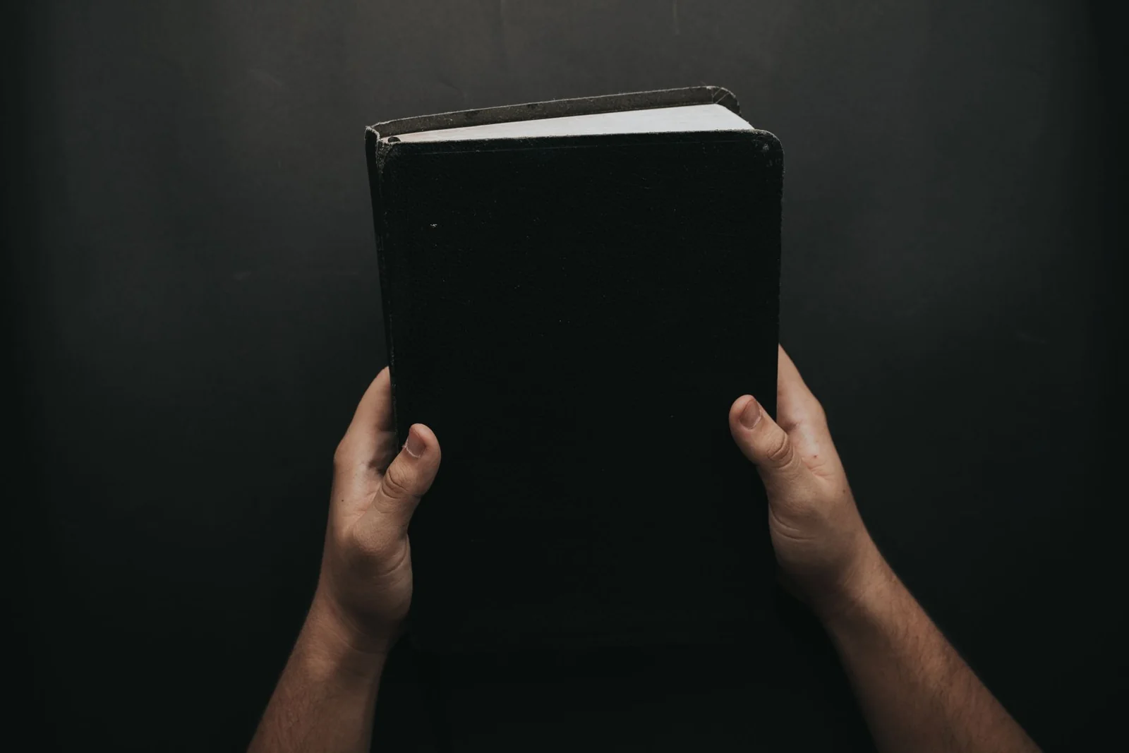 Hands holding a Bible in a moment of quiet faith